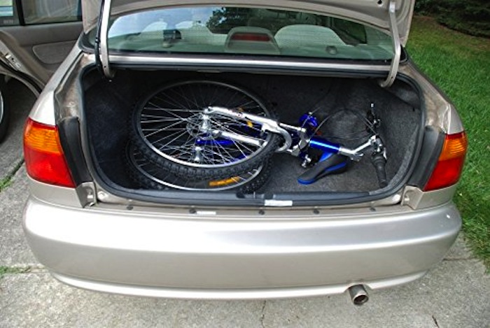 folded Columbia bike in trunk